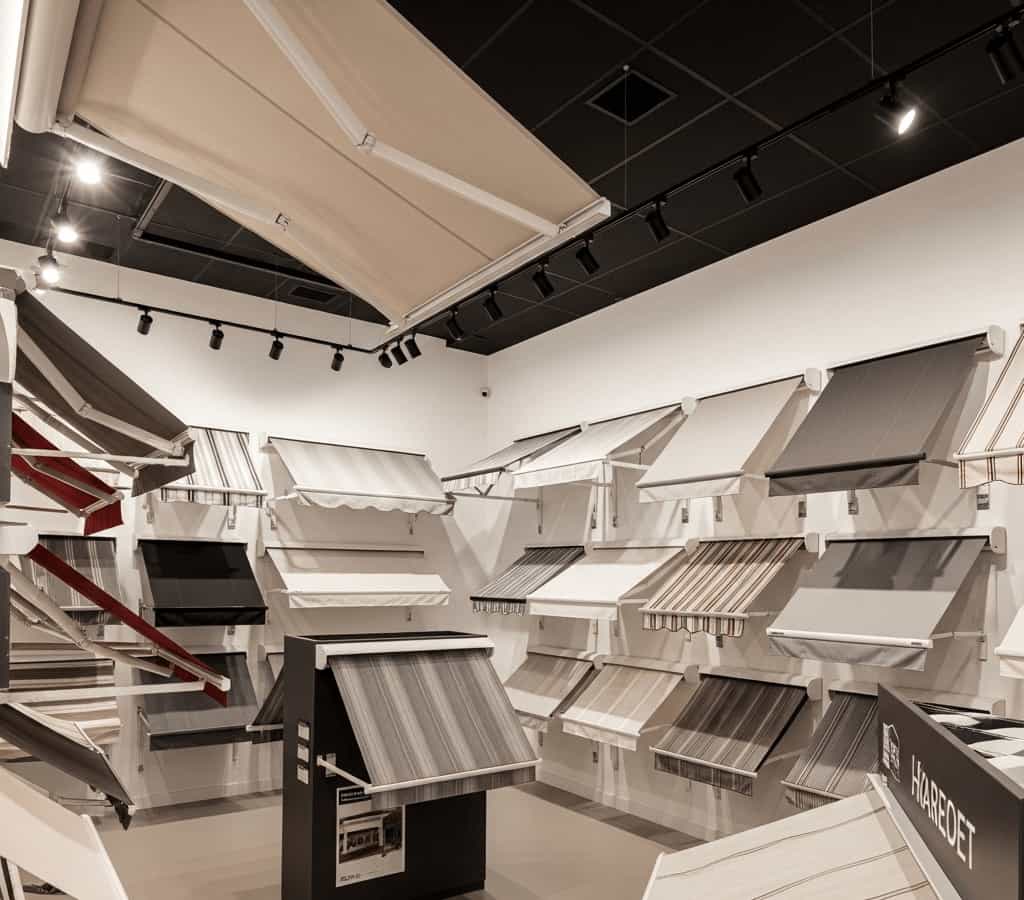 Interior view of an Australian awning showroom displaying a wide variety of aluminium awning designs, styles, and fabric options.